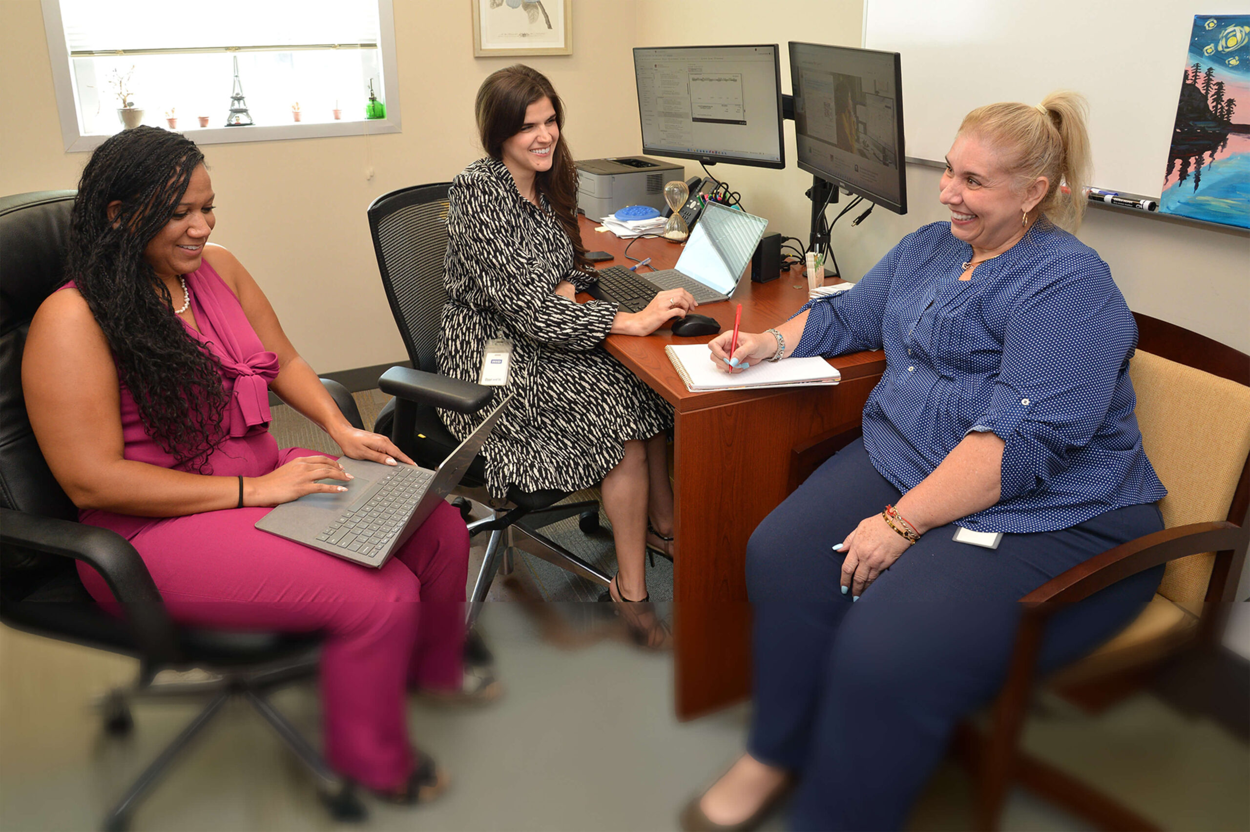 Catalyst employees collaborating in an office