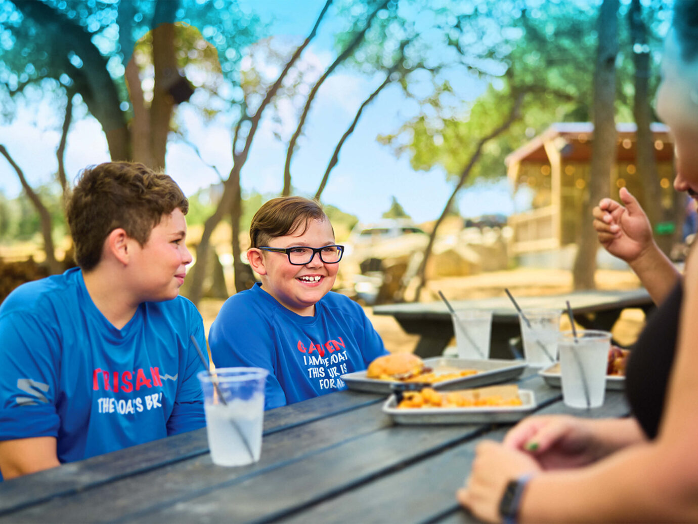 Duchenne muscular dystrophy patient with family at a picnic table