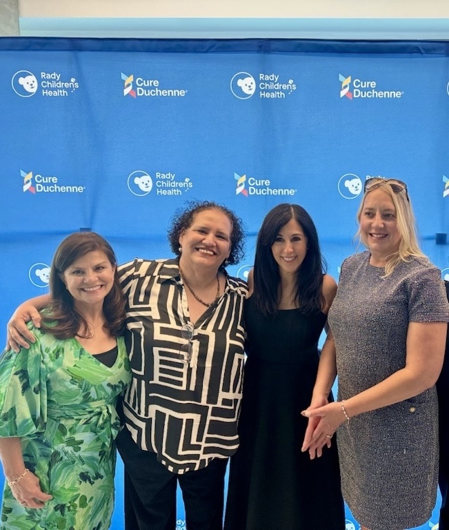 Catalyst employees posing at an event.