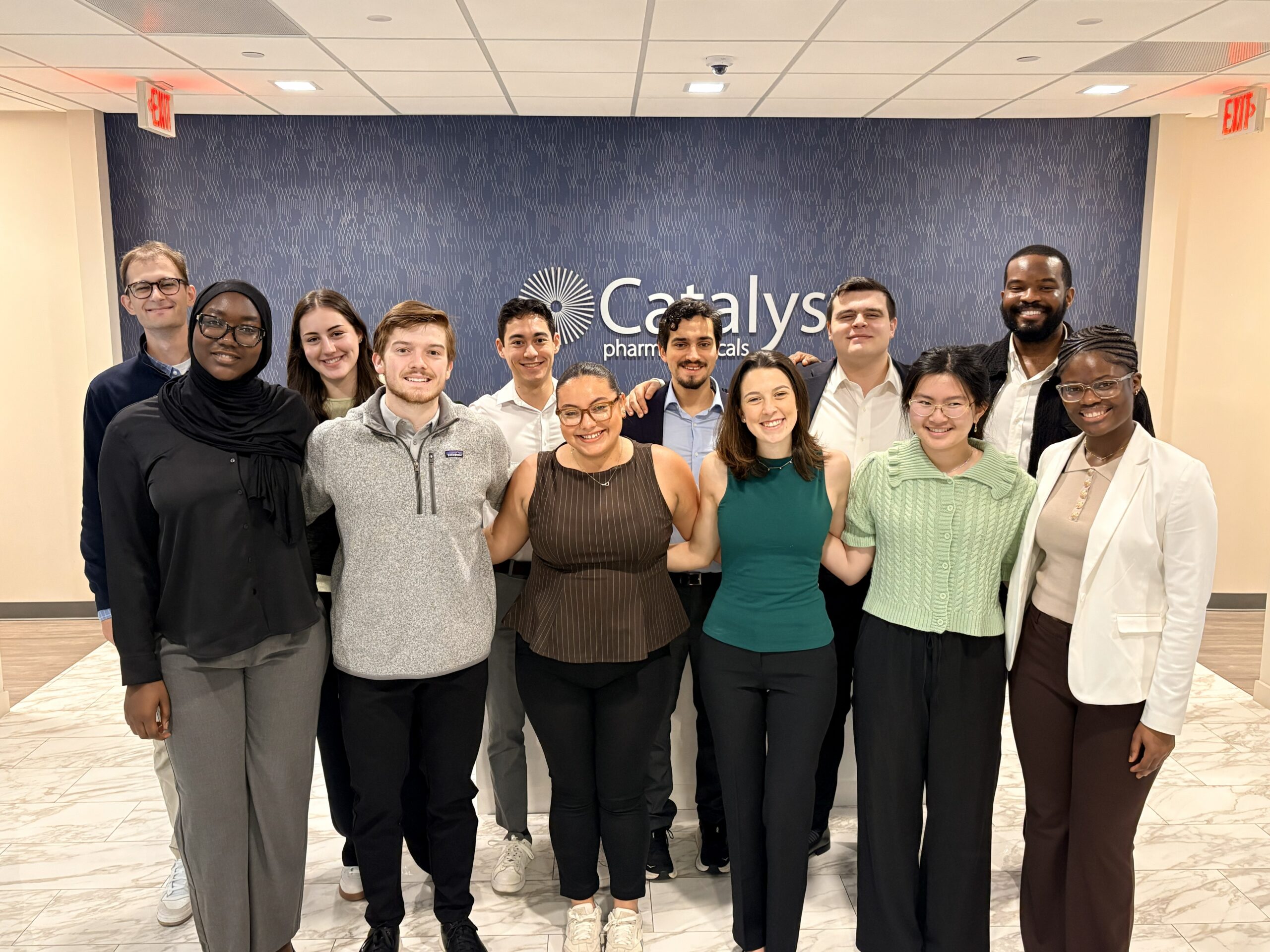 Scholars from the University of Notre Dame posing at Catalyst Pharmaceuticals.