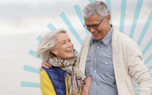A man and a woman walking together and smiling