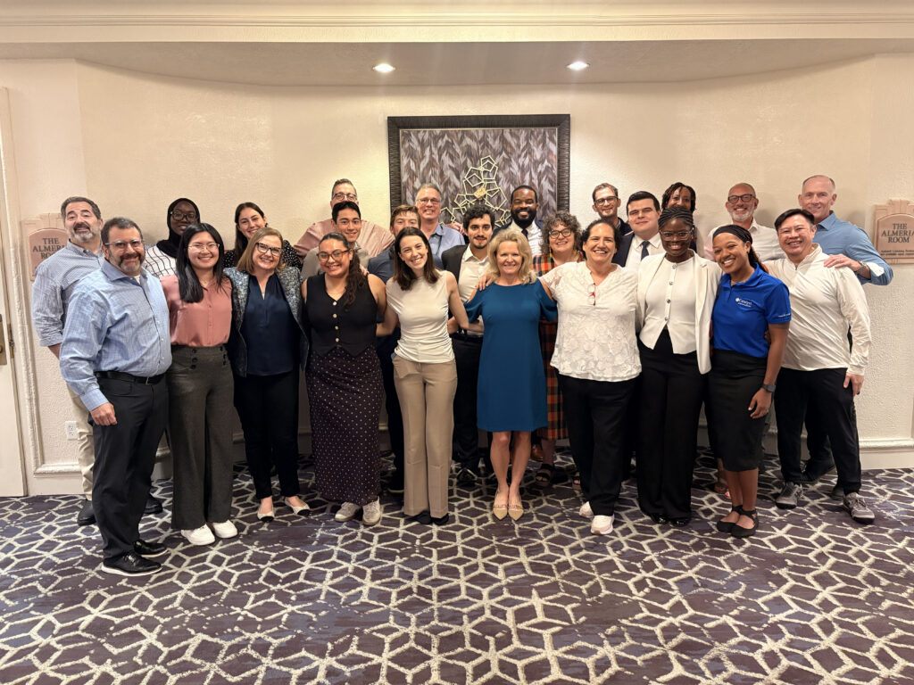 Scholars from the University of Notre Dame posing with Catalyst employees.